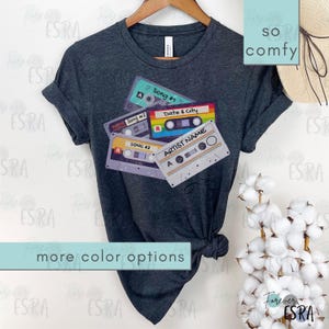 Customizable Concert short sleeve crewneck Tshirt t-shirt tee shirt. Vintage Cassette Tape Tee Shirt For Concerts, Music Fan Gift, Country Music Gifts, Personalized 80's Inspired Tshirt. Customize with artist name, three favorite songs, date and city
