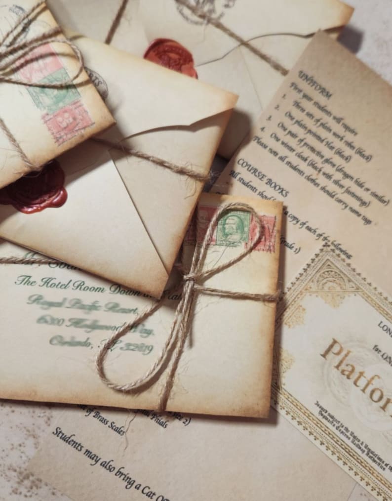 May include: A stack of vintage envelopes tied with twine and sealed with wax. The envelopes are addressed to a fictional character and include a Hogwarts acceptance letter with the text "Platform 9 3/4".