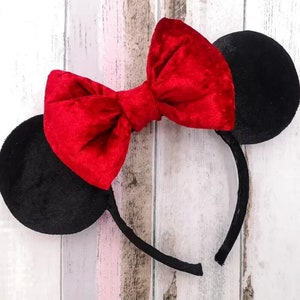 May include: Red velvet bow headband with black velvet ears.