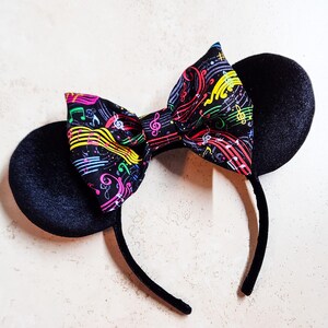Black velvet hair bow with rainbow color embellishment ￼ Black velvet hair bow with Rhinestone rainbow color  main image 4