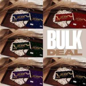 May include: A collection of chocolate bars with the word "BELIEVE" on the packaging, arranged on a wooden tray with macrame coasters. The bars come in various colors, including blue, red, green, purple, and black. The words "BULK DEAL" are in the background.