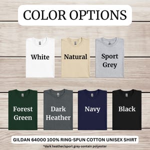 May include: Color options for a Gildan 64000 unisex t-shirt. The colors are white, natural, sport grey, forest green, dark heather, navy, and black.