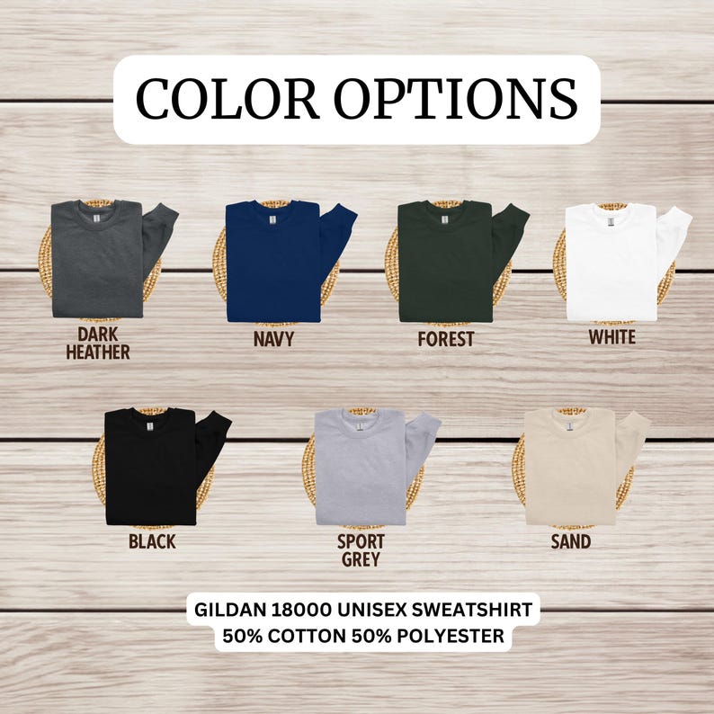 May include: Color options for a Gildan 18000 unisex sweatshirt. The sweatshirt is available in dark heather, navy, forest, white, black, sport grey, and sand.