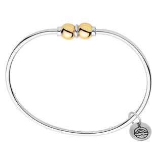 May include: A silver bangle bracelet featuring two polished gold-tone spherical beads separated by a small silver spacer at the top. A small, round silver charm hangs from the side, engraved with a graphic of a sun rising over waves.