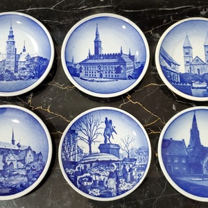 6 Royal Copenhagen miniature 2010 series plates from the early 70s. This includes 1-2010, 15-2010, 19-2010, 40-2010, 47-2010, 66-2010
