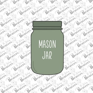 May include: A green mason jar with the words "MASON JAR" written in white on the front.