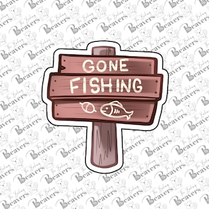 May include: A brown wooden signpost cookie cutter with a vertical post and three horizontal planks. The top plank reads GONE and the middle plank reads FISHING in white lettering. The bottom plank features a small white outline of a fish icon.