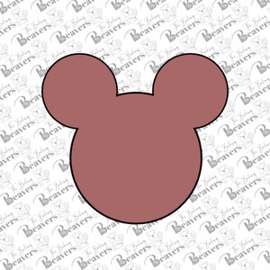 May include: A brown mouse-shaped cookie cutter with a black outline.