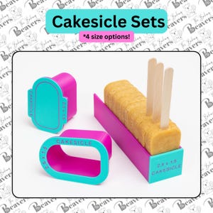 May include: A set of bright pink and teal cakesicle molds and cutters. The items feature the text "CAKESICLE" and "2.5 x 1.5". One rectangular mold contains a row of light brown cake treats with wooden sticks inserted into the top of each piece.