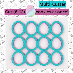 May include: A turquoise blue cookie cutter with a pink outline. The cutter is shaped like a grid of 12 egg shapes. The text "EGG" and "1.5" are printed on the cutter. The text "Multi-Cutter" and "cookies at once!" are printed above the cutter. The text "Cut (6-12)" is printed below the cutter.