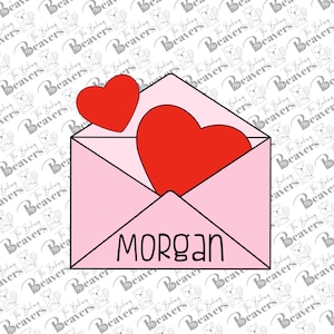 May include: A pink envelope with a red heart peeking out of the top. The envelope has the name "Morgan" written on the front.