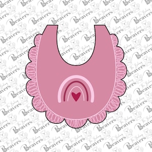 May include: A pink baby bib-shaped cookie cutter with a scalloped edge. The bib features a rainbow design with a heart in the centre. The Baking Beavers logo is in the background.