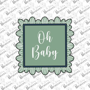 May include: A green and white scalloped frame with a blue border. The text "Oh Baby" is written in white inside the frame.