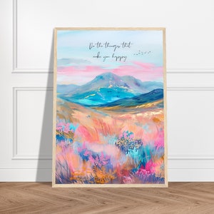 May include: A colorful abstract painting of a mountain landscape with a quote that reads "Do the things that make you happy". The painting features a pink and blue sky, a mountain range, and a field of flowers in shades of pink, blue, and green.