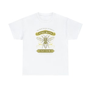 May include: White t-shirt with a gold graphic of a bee with the text "The Herb Society of America Fuzzy Butts Fan Club" and the tagline "Let's count some bees and other pollinators!"