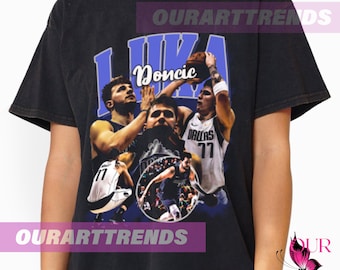 May include: Black t-shirt with a vintage-style graphic of Luka Doncic, a basketball player for the Dallas Mavericks. The graphic features multiple images of Doncic playing basketball, with the text "Doncic" in purple.