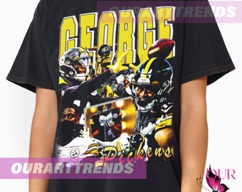 Puede incluir: Camiseta negra con un gráfico de estilo vintage del jugador de fútbol americano de los Pittsburgh Steelers, George Pickens. El gráfico tiene un esquema de color amarillo y negro e incluye el texto "George Pickens".
