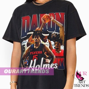 May include: Black t-shirt with a vintage-style graphic of a basketball player, with the text "Daron Holmes II" and "Flyers 15" on the shirt.