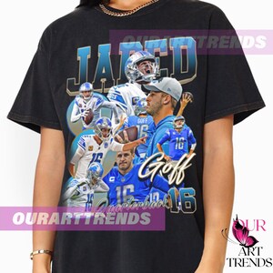 May include: Black t-shirt with a vintage-style graphic of a football player, featuring the text "Jared Goff Quarterback 16".