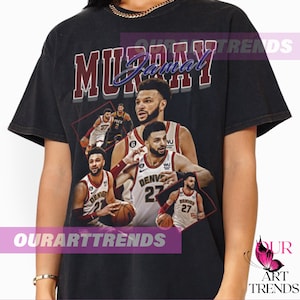 May include: Black t-shirt featuring a vintage-style graphic of basketball player Jamal Murray. The graphic includes multiple images of Murray in different basketball uniforms, including a Denver Nuggets jersey with the number 27.