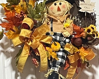 Scarecrow Fall Wreath with Maple Leaf Fall Foliage, large Acorns and mini Sunflowers is full of whimsical beauty and fun. Happy Fall Ya’ll.