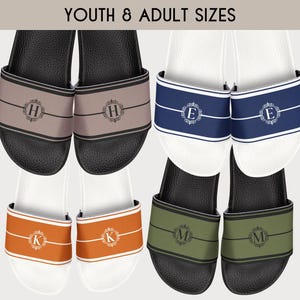 May include: Six pairs of personalized slides in various colors. The slides feature a monogrammed design with a decorative border. The slides are available in youth and adult sizes.  YOUTH & ADULT SIZES