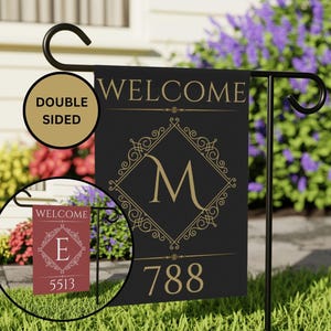 May include: Double-sided welcome garden flag with a black background, gold lettering, and a gold ornate frame around the letter "M" and the house number "788".