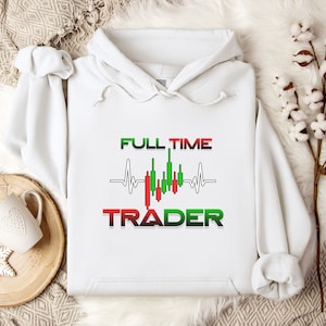 May include: White hoodie with a graphic design of a heartbeat with a candlestick chart inside and the text "FULL TIME TRADER" in red and green.