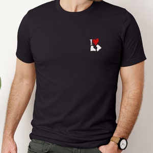 May include: Black t-shirt with a white graphic of roller skates and a red heart with the text "I love" in front of the heart.