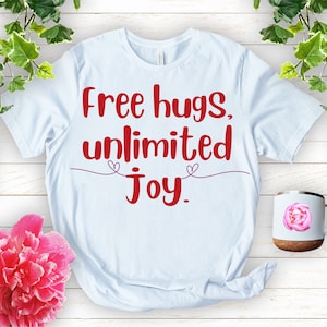 Maglietta in cotone biologico Free Hugs: maglietta divertente per la giornata degli abbracci