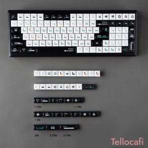 May include: A black and white mechanical keyboard with additional keycaps. The keyboard has white keycaps with black lettering and black keycaps with white lettering. The image also shows keycaps of various sizes, with measurements in inches.