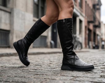 Zwarte leren kniehoge laarzen minimalistische handgemaakte custom fit avant-gardeschoenen
