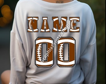 May include: A light gray sweatshirt with a football-themed design on the back. The design includes the word "NAME" in brown football shapes and the number "00" in a similar style. The text "GraphixPrintz.shop" is at the bottom.