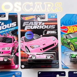 Puede incluir: Colección de coches de juguete Hot Wheels, incluyendo modelos Honda S2000 rosas, verdes, rojos y amarillos. Algunos presentan la marca "Fast & Furious" y el embalaje "Neon Speeders". Los coches están en su embalaje original.