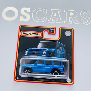 Matcbox 2015 Mercedes-Benz G 500 azul die cast car. Cartão curto.
