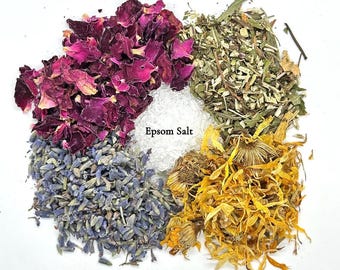 May include: An overhead shot of a circular arrangement of natural ingredients. Rose petals, peppermint, lavender, calendula, and Epsom salt are labeled. The rose petals are a deep red, the lavender is purple, and the calendula is yellow.