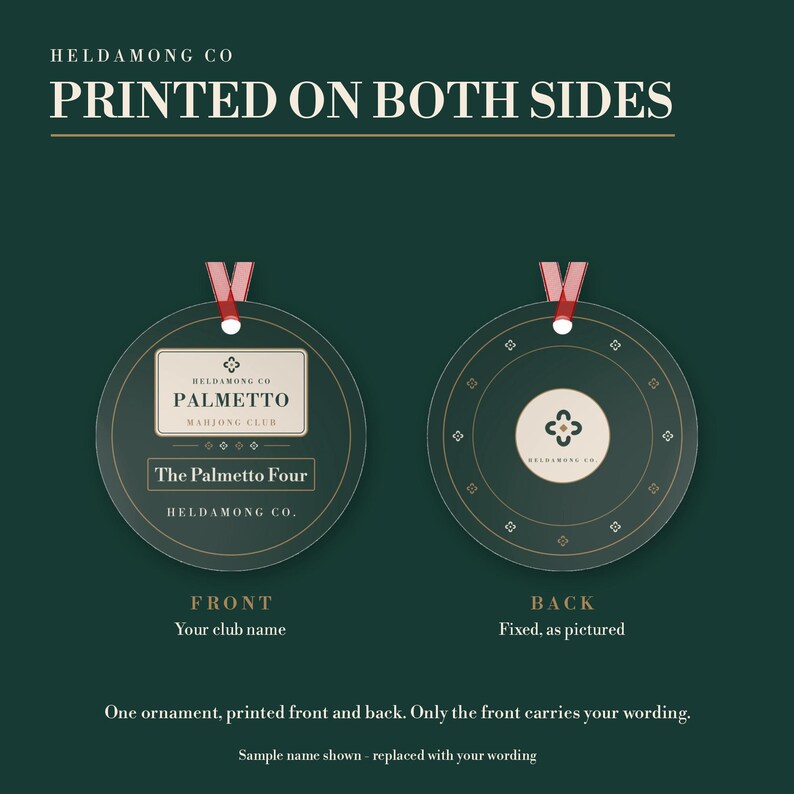 May include: A round dark green ornament with a red ribbon hanger. The front features the text HELDAMONG CO, PALMETTO MAHJONG CLUB, and The Palmetto Four. The back displays a circular logo with a four-petal symbol and the text HELDAMONG CO.