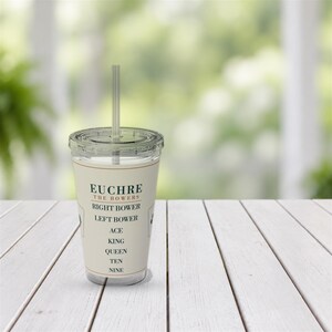 May include: A clear plastic tumbler with a lid and straw featuring a cream-coloured label printed with the text EUCHRE THE BOWERS followed by a list of card ranks including RIGHT BOWER, LEFT BOWER, ACE, KING, QUEEN, TEN, and NINE in dark green.