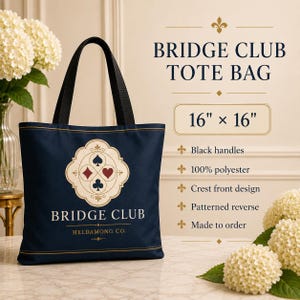 May include: A navy blue tote bag measuring 16 inches by 16 inches with black handles. The front features a cream-colored crest with four card suit symbols and the text BRIDGE CLUB HELDAMONG CO. The bag is made of 100% polyester fabric.