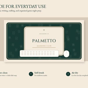 May include: A rectangular dark green desk mat featuring a repeating pattern of small white mahjong tile icons. The centre displays a cream-coloured rectangular area with the text PALMETTO MAHJONG CLUB and HILDAWONG.CH. A white keyboard and mouse sit on the mat.