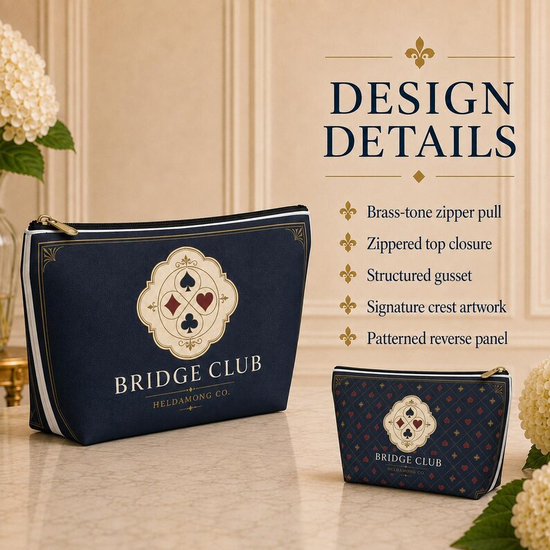 May include: Two navy blue zippered pouches with white and gold accents. The larger pouch features a central crest with card suit symbols and the text BRIDGE CLUB HELDAMONG CO. The smaller pouch has a repeating diamond pattern and the same crest.