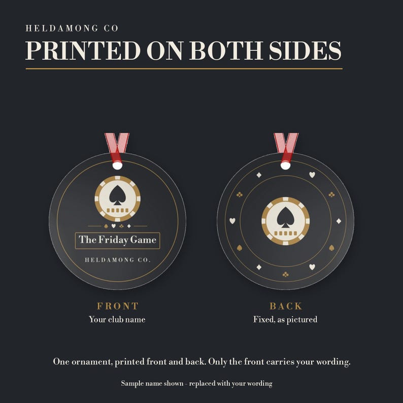 May include: Two round ornaments with red ribbons, featuring a black background and a beige poker chip graphic with a spade. The front displays the text "The Friday Game" and "HELDAMONG CO." while the back shows a pattern of card suit symbols.