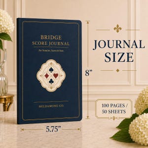 May include: A navy blue bridge score journal with gold lettering and a central card suit emblem. The cover reads BRIDGE SCORE JOURNAL, For Notation, Scores & Stats, and HELDAMONG CO. It measures 8 inches by 5.75 inches and contains 100 pages.