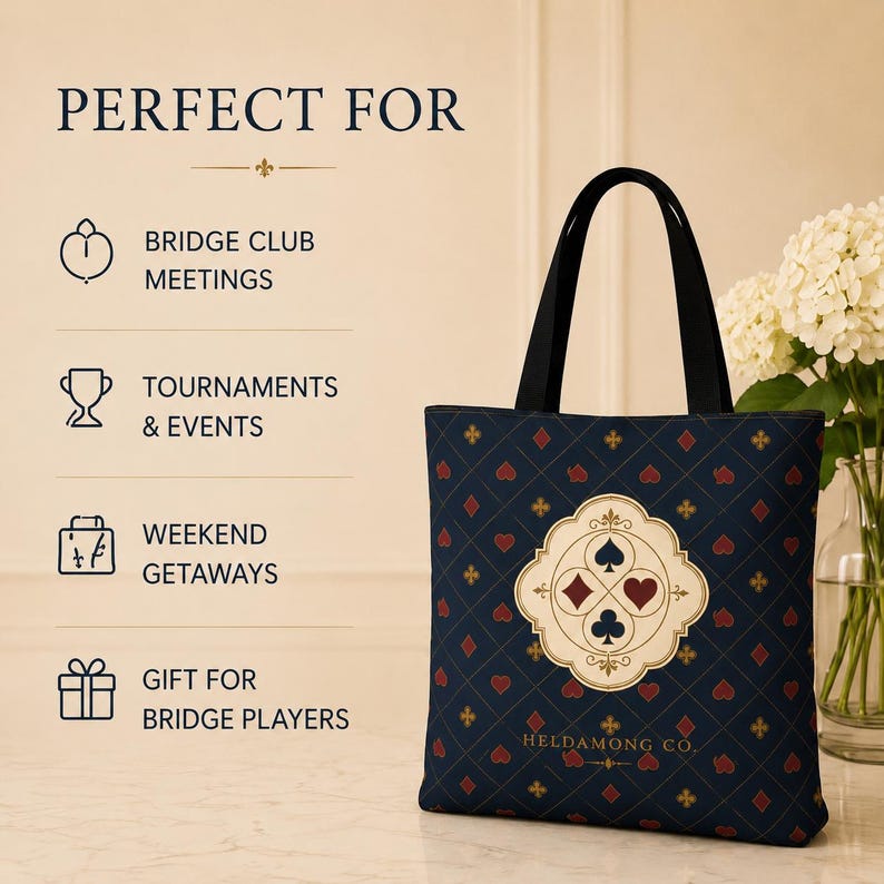 May include: A navy blue tote bag with black handles featuring a repeating pattern of red and gold card suit symbols. A central cream-coloured emblem displays the four card suits. Text reads: PERFECT FOR BRIDGE CLUB MEETINGS, TOURNAMENTS & EVENTS, WEEKEND GETAWAYS, GIFT FOR BRIDGE PLAYERS, HELDAMONG CO.