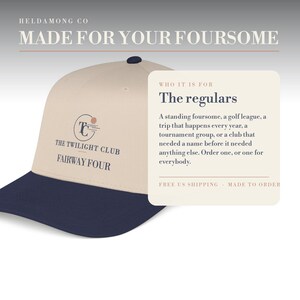 May include: A beige baseball cap with a dark navy blue brim. The front features a circular logo with the text THE TWILIGHT CLUB and FAIRWAY FOUR. An adjacent information card displays the text WHO IT IS FOR, The regulars, and a description.