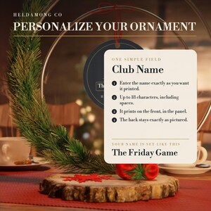 May include: A circular ornament display featuring a pine branch and a cream-colored instruction card. The card reads: PERSONALIZE YOUR ORNAMENT, ONE SIMPLE FIELD, Club Name, 1 Enter the name, 2 Up to 18 characters, 3 It prints on the front, 4 The back stays exactly as pictured, YOUR NAME IS SET LIKE THIS, The Friday Game.