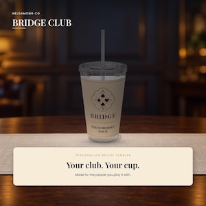 May include: A clear plastic tumbler with a lid and straw, featuring a beige wrap with a decorative emblem containing card suit symbols. The text reads BRIDGE, THE SOMERSET FOUR, and the graphic includes a stylized design of hearts, diamonds, clubs, and spades.