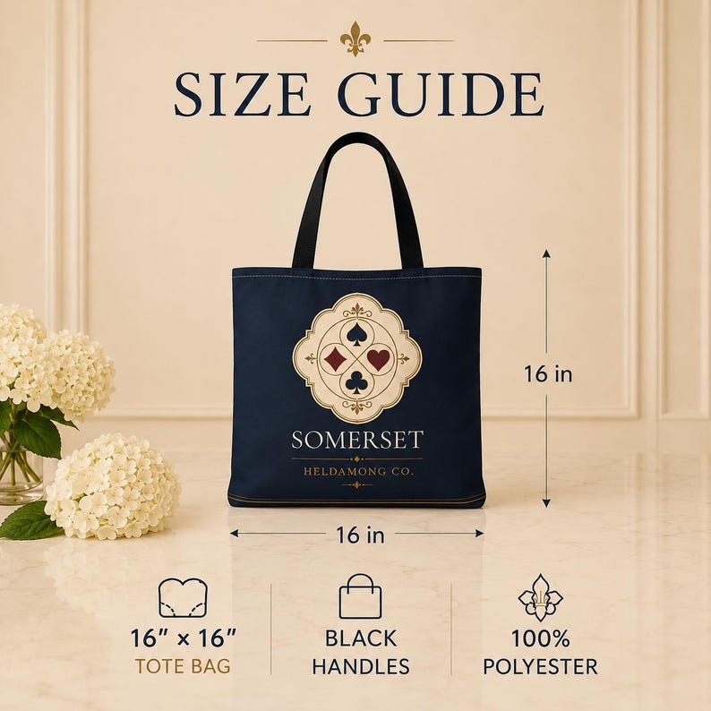 May include: A navy blue tote bag with black handles, featuring a central cream-coloured emblem with four playing card suits. Text reads SIZE GUIDE, SOMERSET, HELDAMONG CO., 16 in x 16 in, and 100% POLYESTER. Dimensions are marked as 16 inches by 16 inches.
