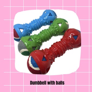 May include: Three dog toys shaped like dumbbells with balls on the ends. The dumbbells are blue, green, and red. The balls are multi-colored.