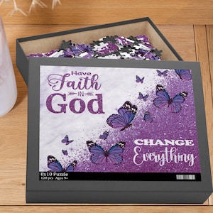 May include: A gray puzzle box with a partially assembled puzzle inside. The box features the text "Have Faith in God" and "Change Everything" with purple butterflies on a white and purple background. The puzzle is 8x10 inches and has 120 pieces.